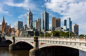 Melbourne city skyline behind Princes Bridge over the Yarra River on a clear day